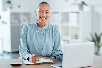 Image showing Modern, smiling and young business woman enjoying her work in a office at a computer indoors. Portrait of a happy junior corporate lawyer working, making notes and planning a successful job strategy