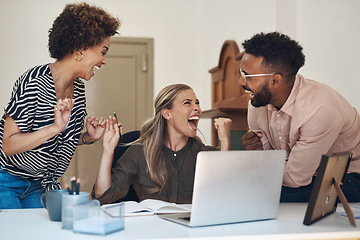 Image showing Happy, smiling and cheering young university or college students excited after completing a project. Casual team of learners celebrating after getting a good grade on a their research assignment