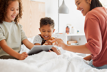 Image showing Mother, daughter and son on a tablet relaxing in their home, watching fun cartoons and spending time together. Happy family, on a digital device learning and playing a game in the childrens bedroom.