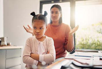 Image showing Upset, discipline and family while offended and stubborn little girl looking unhappy with her scolding mother in the background. Naughty, problem and bad child angry and ignoring her parent at home