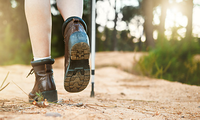 Image showing Hiking, walking and active feet closeup of an outdoors hike, walk and adventure on a mountain trail. Relaxing, freedom and carefree activity outside in nature on a sunny summer day in the mountains