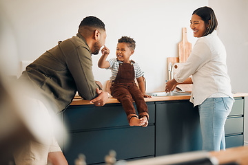 Image showing Parents, child and home of a fun, loving and caring family being playful with their son. Funny father making silly faces with his boy while having a laugh together with his wife in a kitchen.