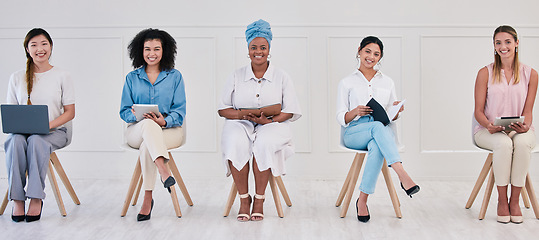 Image showing Female corporate marketing or advertising planning team working in a creative agency for online website design company. Portrait of empowering women in diverse workplace with good ideas and strategy