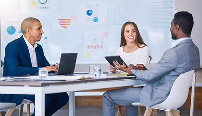 Image showing Networking, negotiating and professional business partners having a meeting in an office, talking and smiling. Diverse entrepreneurs collaborating on digital design project, planning and discussing