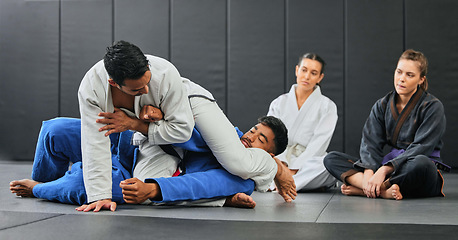 Image showing Fight, karate class and martial arts teamwork in competition, challenge or self defense sport in wellness school. Fitness sports coach teaching students gym workout, floor exercise or health training