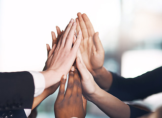 Image showing Business people giving high five for motivation, unity, and support in a meeting together at work. Closeup of hands of colleagues and employees huddling to celebrate a success, victory or win