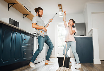 Image showing Having fun doing chores, dancing and singing father and daughter cleaning the living room together at home. Carefree, happy and cheerful parent bonding, doing housework and playing with little girl