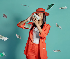 Image showing Cash, fashion and rich lady throwing money and spending away smiling as she shows off her wealth after shopping. Trendy, happy and winning luxury woman with 100 dollar bills in the air at the casino.