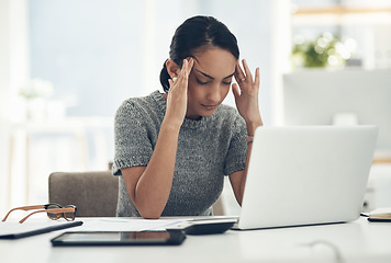 Image showing Headache, tired and stressed young businesswoman with financial problems on laptop sitting at desk. Professional female accountant in accounting finance and corporate business doing taxes and debt.