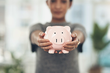 Image showing Piggybank, finance and money in the hands of a woman with a mindset on the future for saving, investment and wealth. Closeup of a coin bank in hand, showing financial growth, planning and budget