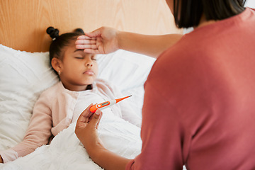 Image showing Covid, care and sick little girl in bed with concerned mother checking temperature with a thermometer. Caring parent worried about her child with a fever, suffering from a cold, flu and covid fatigue