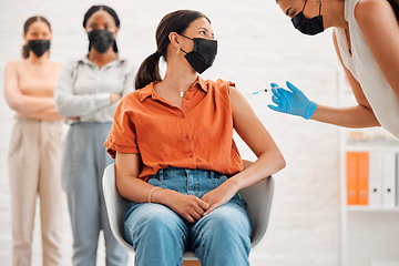 Image showing Vaccine, injection and medicine treatment for covid, flu and pandemic disease with nurse, healthcare or medical professional. Stylish, edgy and creative office woman with mask getting injected in arm