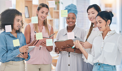 Image showing Sticky notes, planning ideas or vision in training with talking creatives and marketing strategy, kpi and performance data. Motivated, inspired or ambitious team of startup women meeting or learning