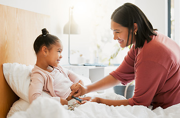Image showing Diabetes, insulin and diabetic happy girl getting injected by her mom in her bedroom for their morning routine at home. Family, mom and kid smiling, medicating and using a finger stick for blood test