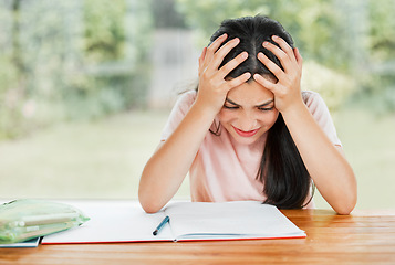 Image showing Stress, anxiety and overwhelmed with a little girl struggling with her studies, education and learning at home. Confused, frustrated and tired student having trouble with homework and study material