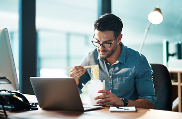 Image showing Business man eating lunch at his desk, reading an email on a laptop and working overtime in office. Corporate professional, manager or employee completing a deadline and browsing internet for ideas