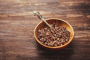 Image showing Cocoa bean nibs  in small bowl - baking ingredients