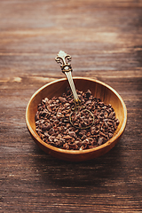 Image showing Cocoa bean nibs  in small bowl - baking ingredients