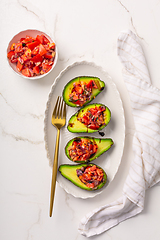 Image showing Avocados filled with bruschetta and balsamic vinaigrette - vegan appetizers