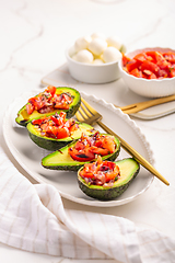 Image showing Avocados filled with bruschetta and balsamic vinaigrette - vegan appetizers