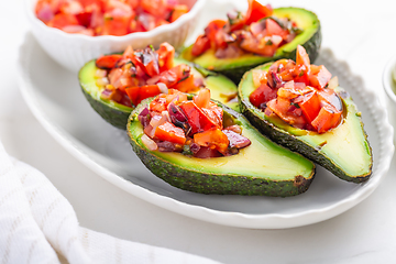 Image showing Avocados filled with bruschetta and balsamic vinaigrette - vegan appetizers