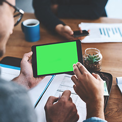 Image showing Green screen, copyspace and chromakey on a tablet screen in the hands of a business man sitting in the boardroom during a meeting. Talking and planning for marketing, advertising and online promotion