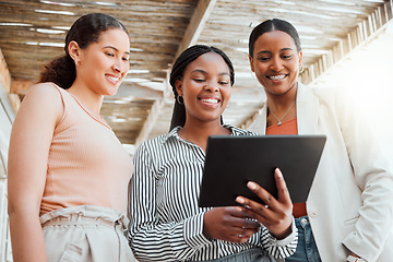 Image showing Startup entrepreneur, small business owner and business woman working together as a a team on a tablet from below. Discussing ui and ix ideas while at work with a mindset of growth and teamwork