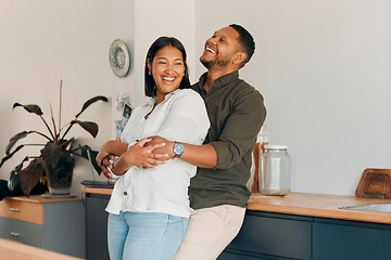 Image showing Hugging, embracing and in love couple in a home living room, kitchen or lounge and bonding, enjoying time together and relaxing. Smiling, happy and laughing man and affectionate woman standing close