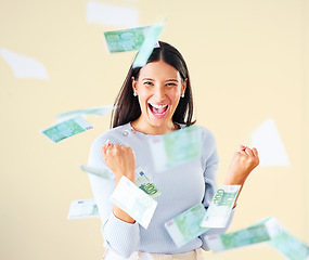 Image showing . Celebrating money, finance and investment growth or savings, wealth or budget development. Portrait of excited, cheering female millionaire with floating bank cash and currency after lottery win.