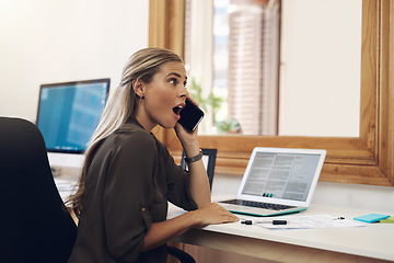 Image showing Surprised, shocked and excited young businesswoman gossiping and listening to fake news on a phone call in the office. Amazed female gasping wow in disbelief with an oh my god expression on her face