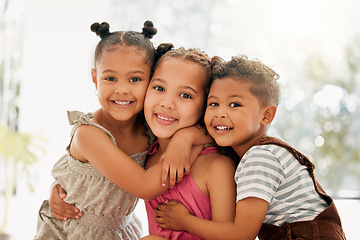 Image showing Siblings, boy and girl children hugging and bonding together as a cute happy family indoors during summer. Portrait of young, brother and sister kids smiling, embracing and enjoying their childhood