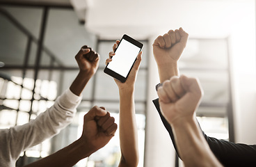 Image showing Hands of business people cheering, celebrating good news on a phone with blank screen for copy space. Excited team of office workers showing power fist gesture for success, victory and winning