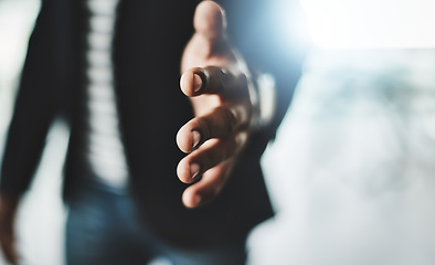 Image showing Handshake, welcome and greeting with a business man reaching out his hand to congratulate, promote or celebrate success. Closeup of teamwork, unity and togetherness with a corporate professional