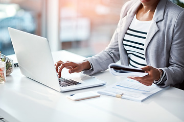 Image showing Business woman typing on laptop, reading from notebook and planning a strategy in an office at work. Corporate employee, manager or boss sending emails, completing a proposal and browsing internet