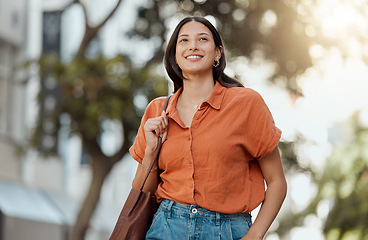 Image showing Stylish, happy and trendy student walking in a city, commuting to a college and enjoying a weekend break downtown. Smiling, edgy or funky woman exploring, visiting and enjoying town while sightseeing