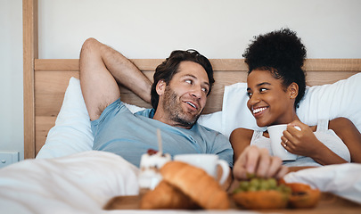 Image showing Valentines surprise, birthday or interracial couple celebrate womens day breakfast in bed by a romantic, husband for his wife together. Sweet, in love and loving man serving his lady food and bonding