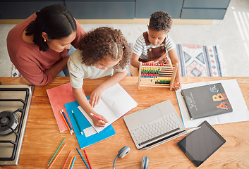 Image showing Learning, education and family doing homework with girl child writing in her book during homeschooling lesson with her mother from above. Student, development and studying during quarantine at home