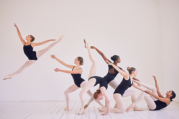 Image showing Group of contemporary or ballet dancers performing a unique sequence in a studio. Team of modern elegant ballerinas dancing or practicing for performance and creating entertainment art