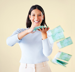 Image showing . Wealthy, rich and happy woman throwing money smiling about her financial success and freedom. Portrait of an excited young female having fun and enjoying her cash and ready to spend.