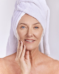 Image showing Skincare, health and beauty, a senior woman, towel on head, and smile on her face, taking care of her skin after a shower. Portrait of happy, mature, elderly female and healthy treatment for wrinkles