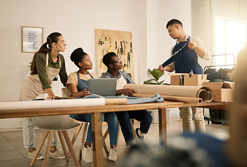 Image showing Serious, young and creative clothing designers planning with laptop, working on clothes and learning about material at a studio together. Diverse, thinking and team of workers designing fashion