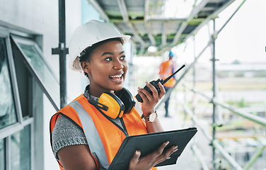 Image showing Construction worker with tablet, walkie talkie or radio talking, instructing and checking building progress on development site. Architect manager, female leader or engineer watching infrastructure