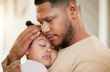 Image showing Father carrying his sleeping daughter, hugging and bonding with affection at home. Caring parent enjoying fatherhood, holding his girl child, enjoying quiet moment of care, consoling and safety