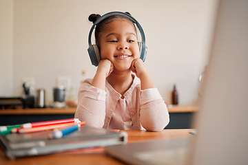 Image showing Distance learning, education and online lesson with girl wearing headphones and laptop webcam. Kindergaten or primary school Student studying with virtual video internet class with a teacher at home
