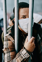 Image showing Sick, refugee of a young covid patient in quarantine to cross the border with a medical face mask. Foreign man in a prison crowd during a pandemic following healthcare safety rules of the virus.