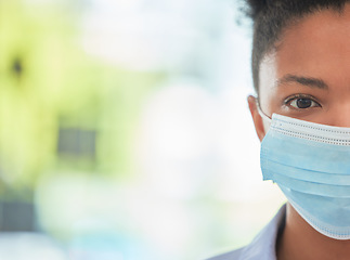 Image showing Humanity, care and protection person in covid mask with half face pose on bokeh or blurred healthcare background. Hygiene woman covering face to stop the spread of virus or disease