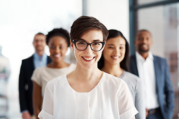 Image showing A happy diverse group of smart and successful businesspeople with a satisfied leader or manager. Portrait of a team of corporate professionals smiling about company growth and development