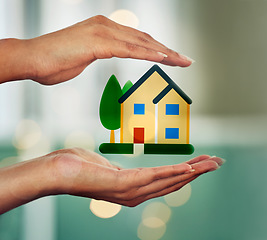 Image showing . Hands holding house, symbol of home cover, insurance or property with bokeh background. Investment, protection and security advertisement with image, diagram and graphic of a house or apartment.