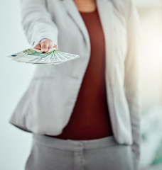 Image showing Money, finance and bribe in the hands of a financial advisor, investment broker or wealth manager offering payment. Cash, currency or bills being held by a foreign exchange professional or investor