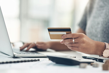 Image showing Banking, payment and paying bills online with ebanking on a laptop with a credit or debit card. Closeup of a woman doing online shopping during inflation. Female making payment for debt and mortgage.